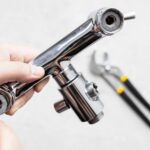 paronite gasket in faucet and adjustable wrench