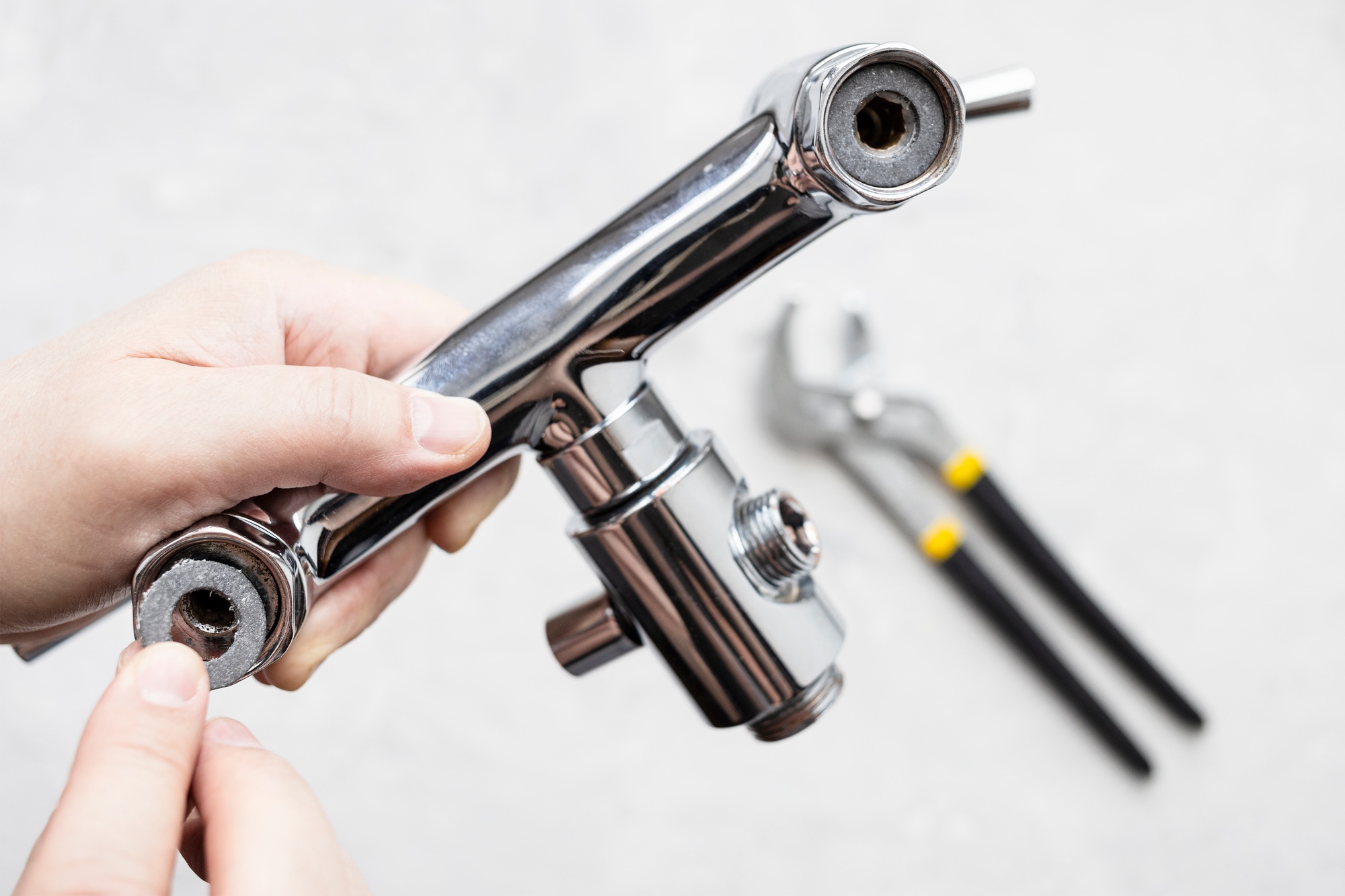 paronite gasket in faucet and adjustable wrench