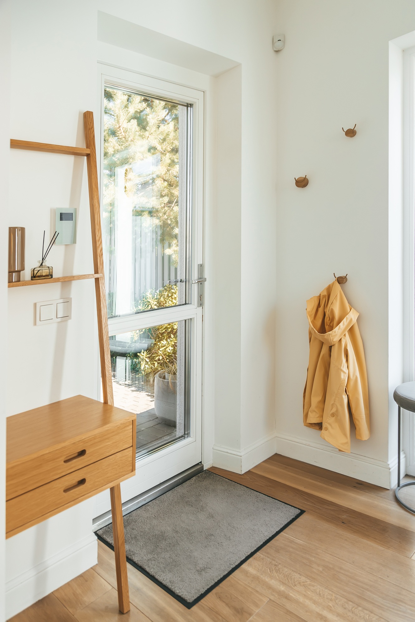 Front entry foyer of a cozy home with wood tones decor