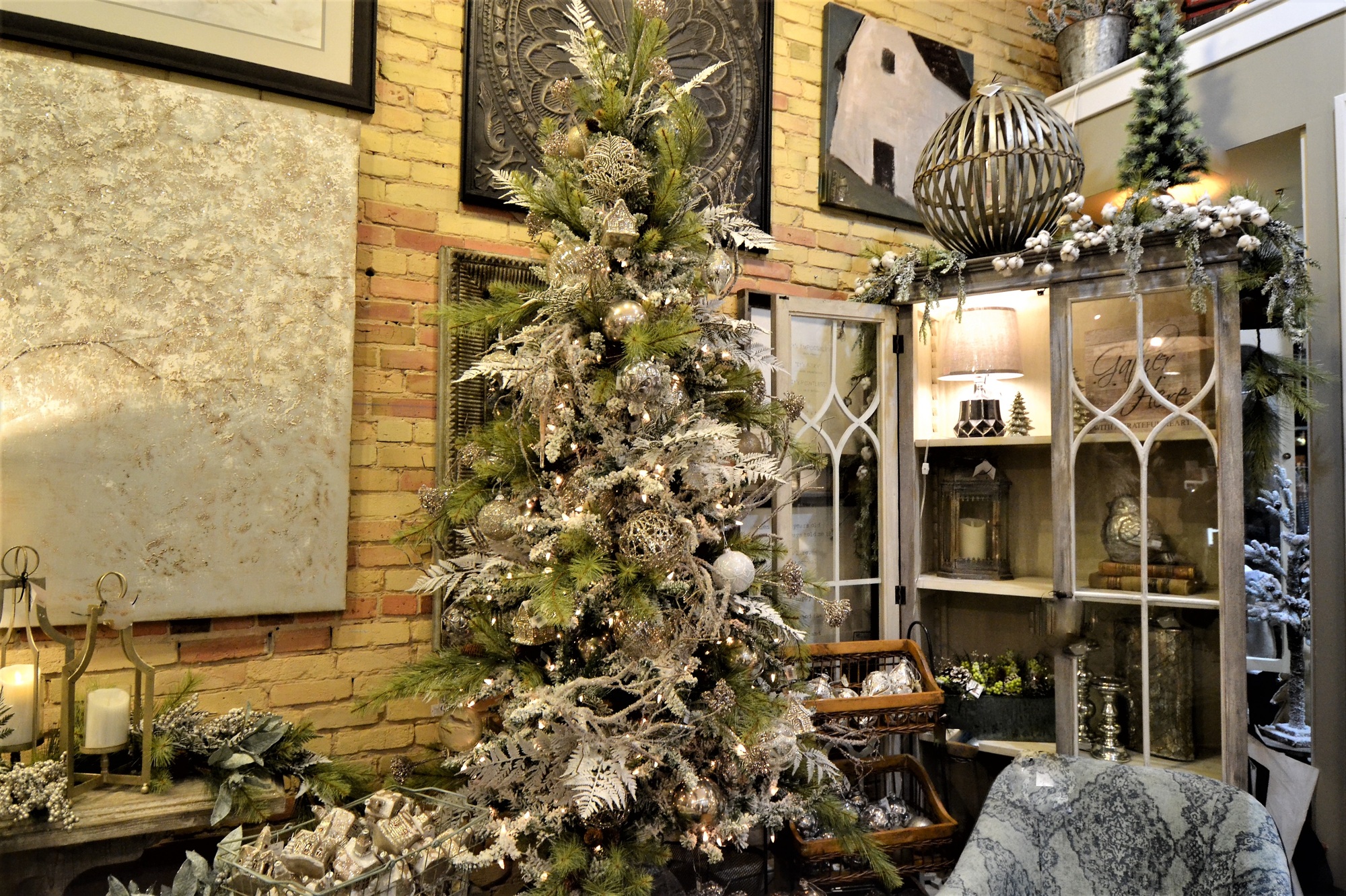Cozy living room adorned with elegant Christmas holiday decorations, including twinkling lights, bells, and seasonal ornaments