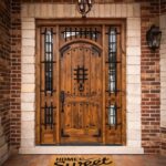 A custom front door with a 'Home Sweet Home' welcome mat, showcasing Meraki Builder’s attention to personalized exterior details