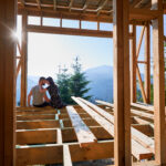 Builder inspecting the framing of a high quality custom home during construction.