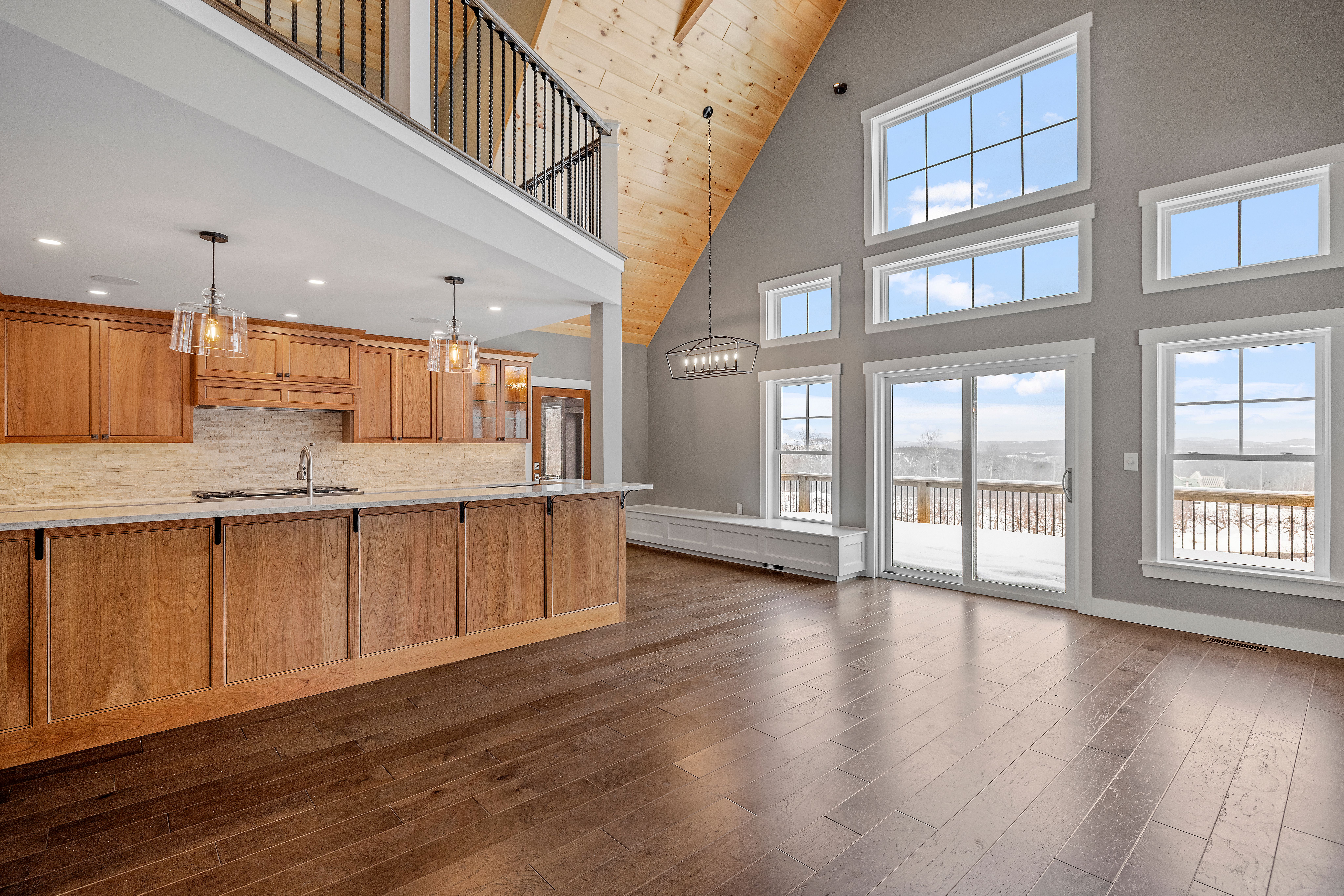 Open concept custom home with vaulted ceilings and large windows that maximize living space.